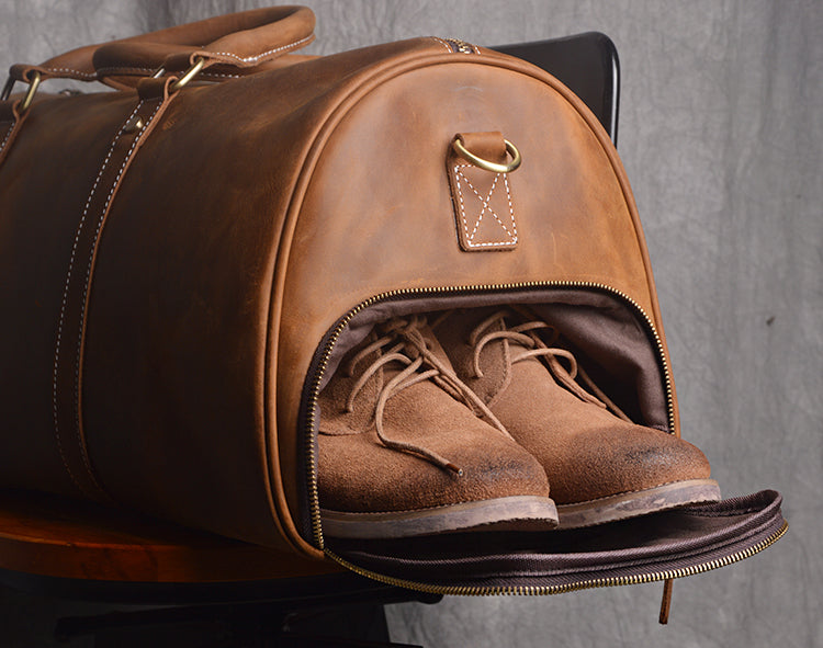 a leather travel duffel or bag Vintage Tan Duffle for Men Luxury Weekender Bag with Shoulder Strap and built to carry stories as much as supplies Leather Duffle Bags for Men